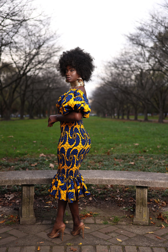 African print smoke body-con dress with puffy sleeves.