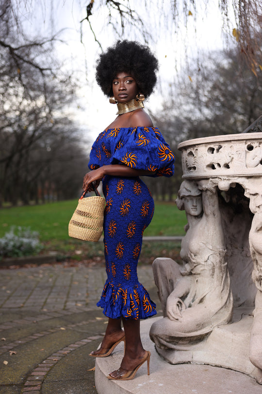 African print smoke body-con dress with puffy sleeves.