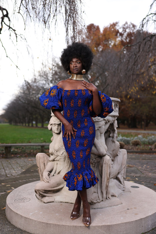 African print smoke body-con dress with puffy sleeves.