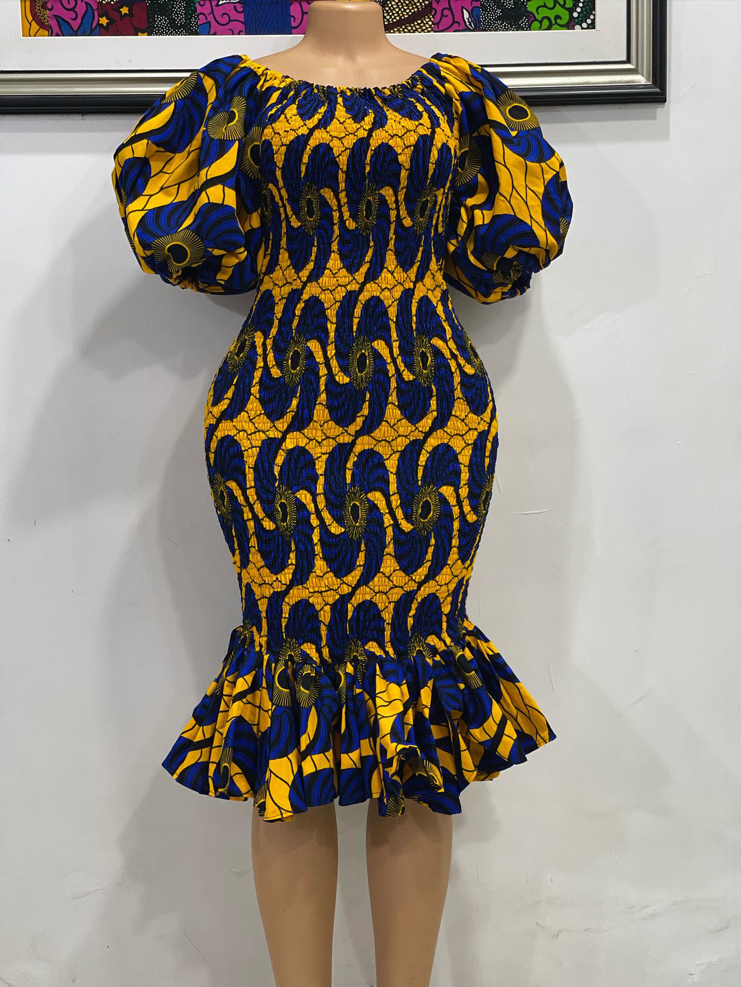 African print smoke body-con dress with puffy sleeves.