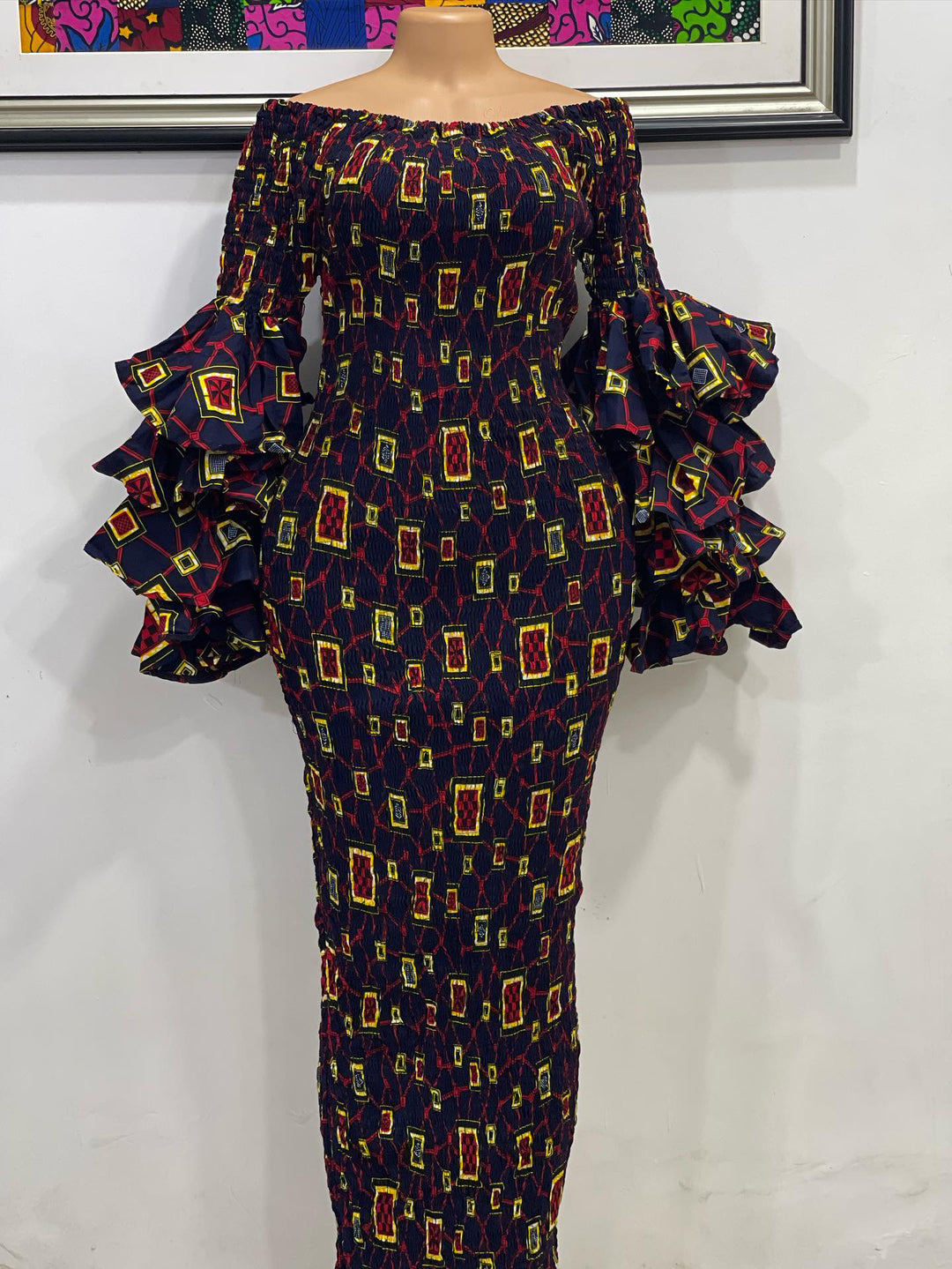 African print smoked bodycon dress with double-layer ruffle sleeves.