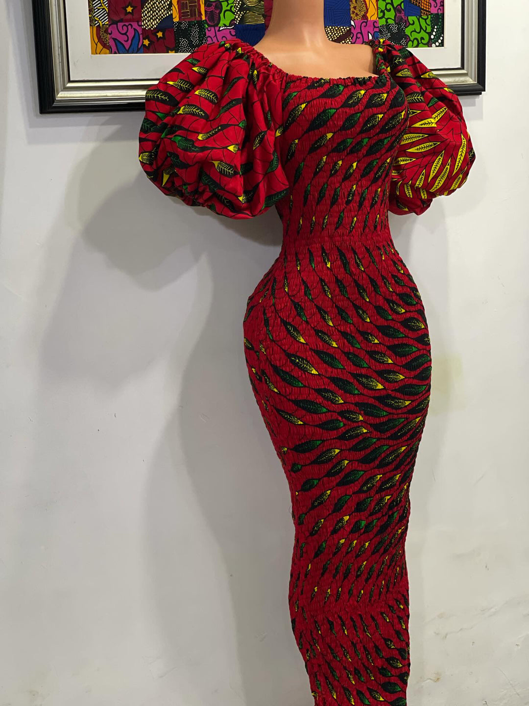 African print stretchy body-con dress with puffy sleeves.