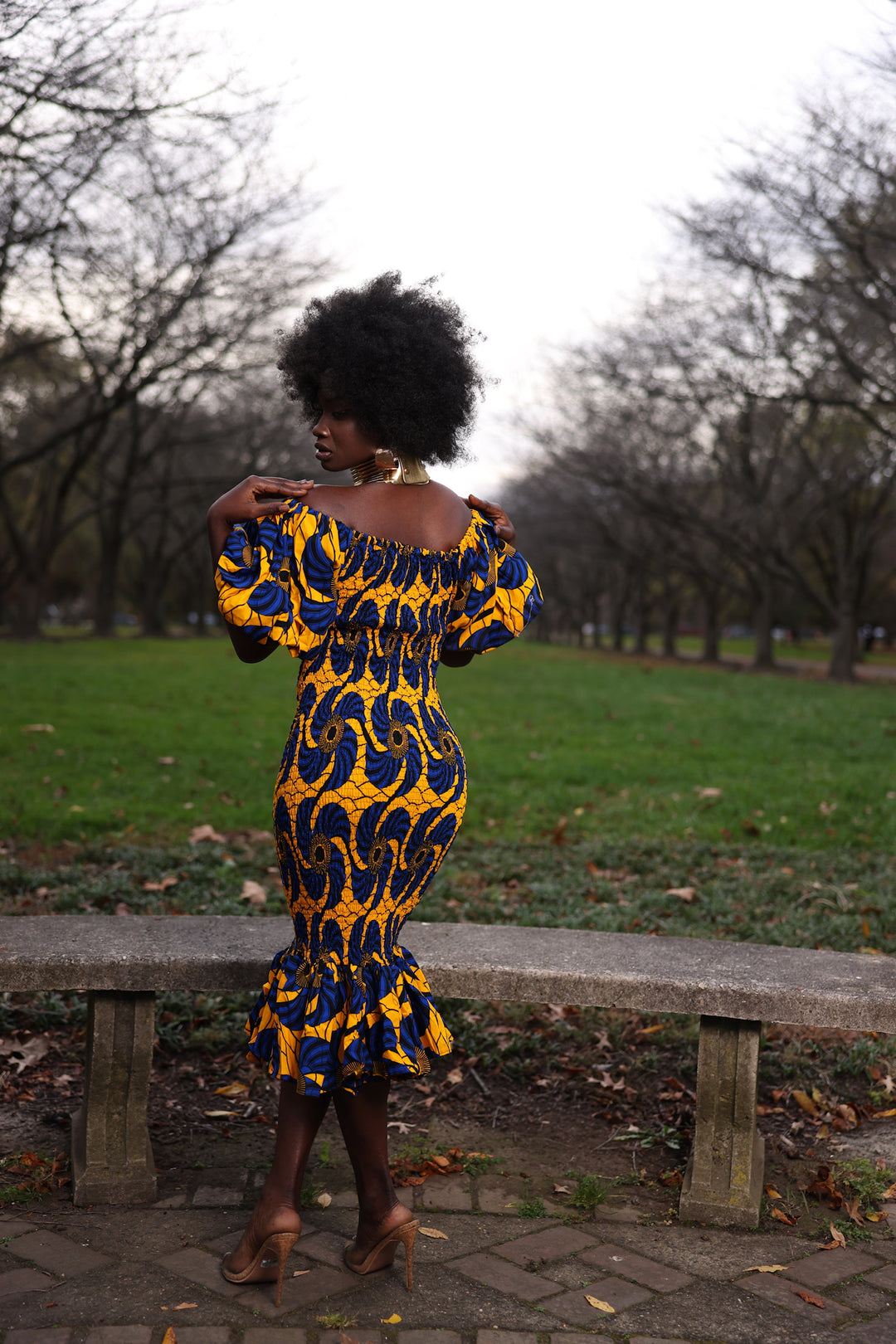 African print smoke body-con dress with puffy sleeves.