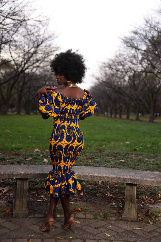 African print smoke body-con dress with puffy sleeves.