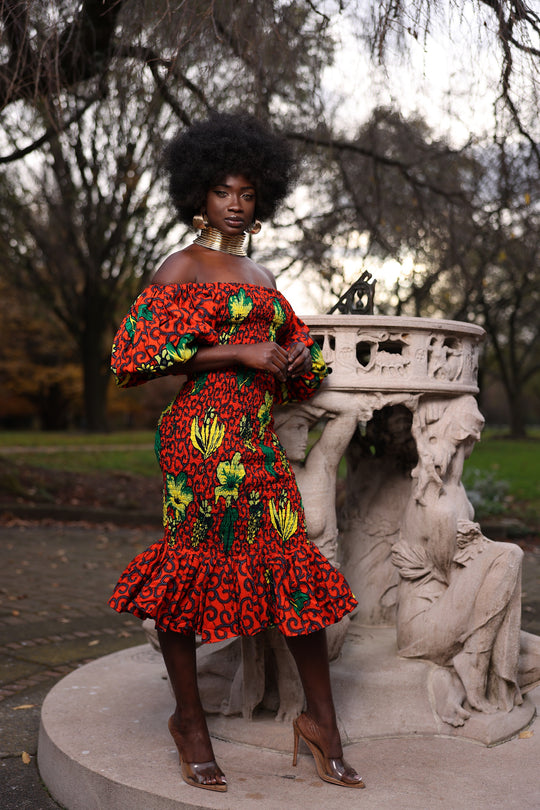 African print smoke body-con dress with puffy sleeves.