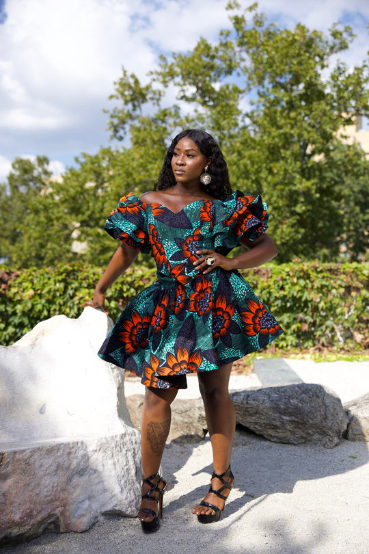 Short African print peplum skirt with dramatic sleeves corset top.