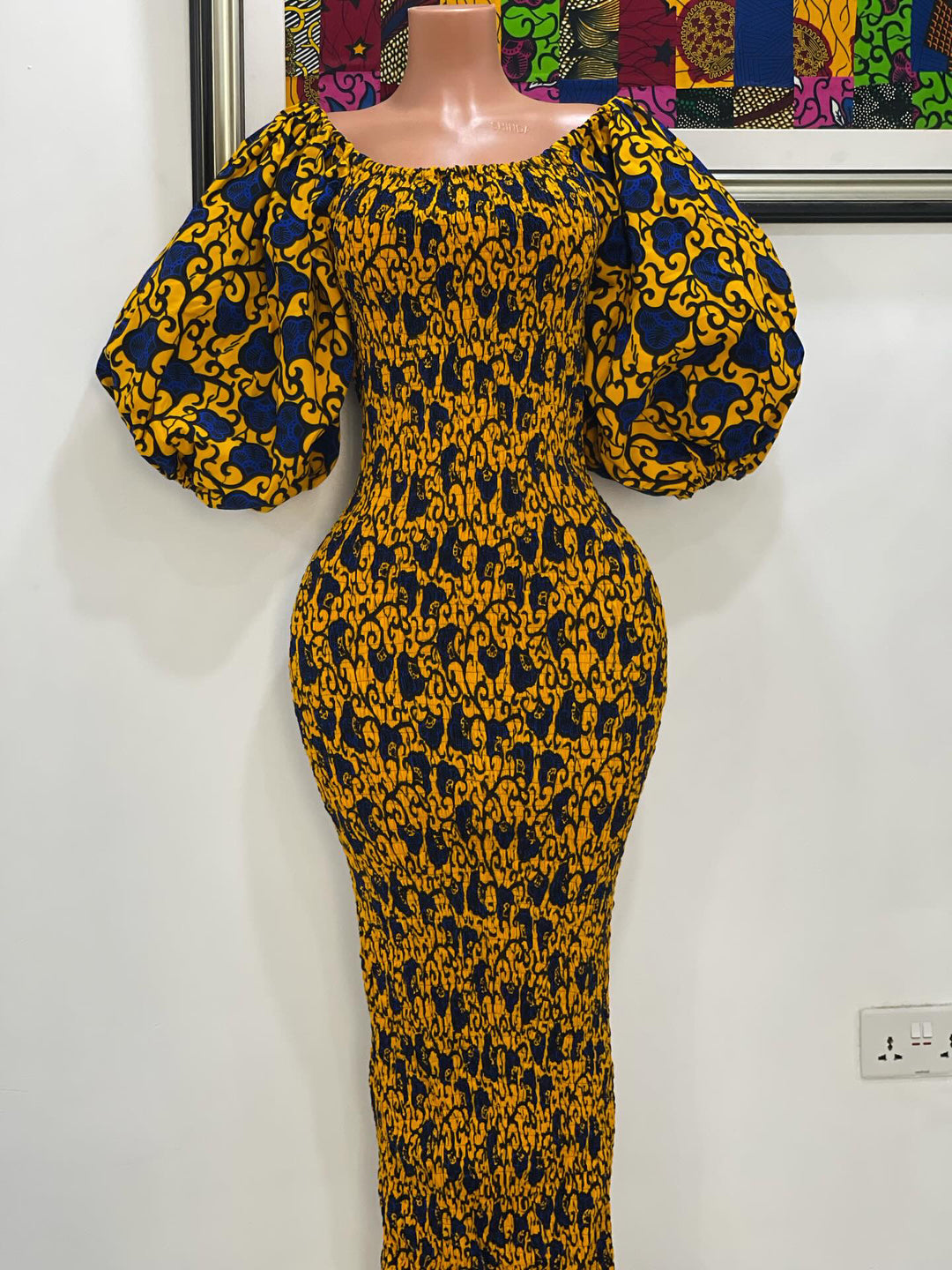 African print stretchy body-con dress with puffy sleeves.