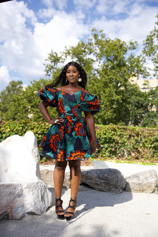 Short African print peplum skirt with dramatic sleeves corset top.