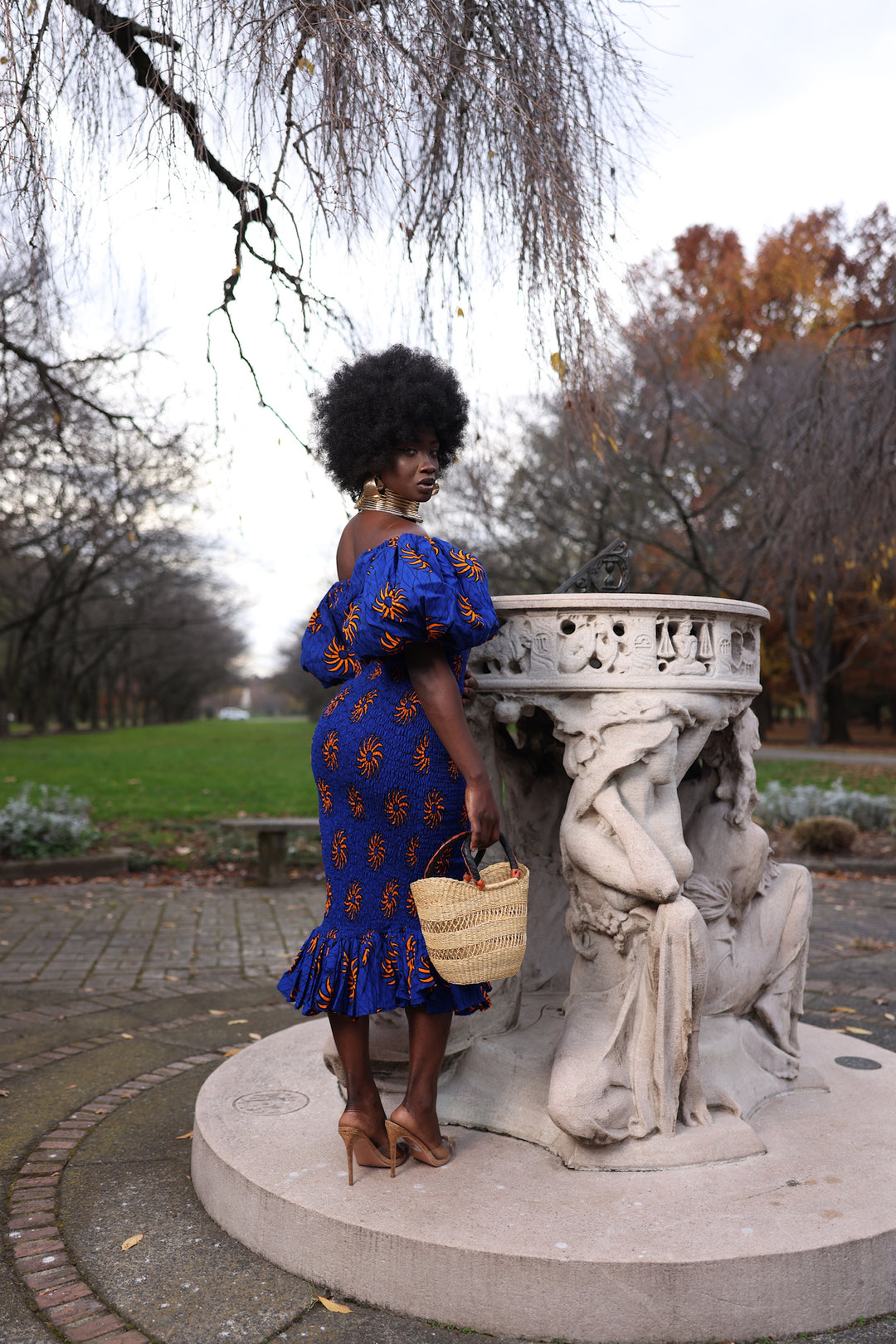 African print smoke body-con dress with puffy sleeves.