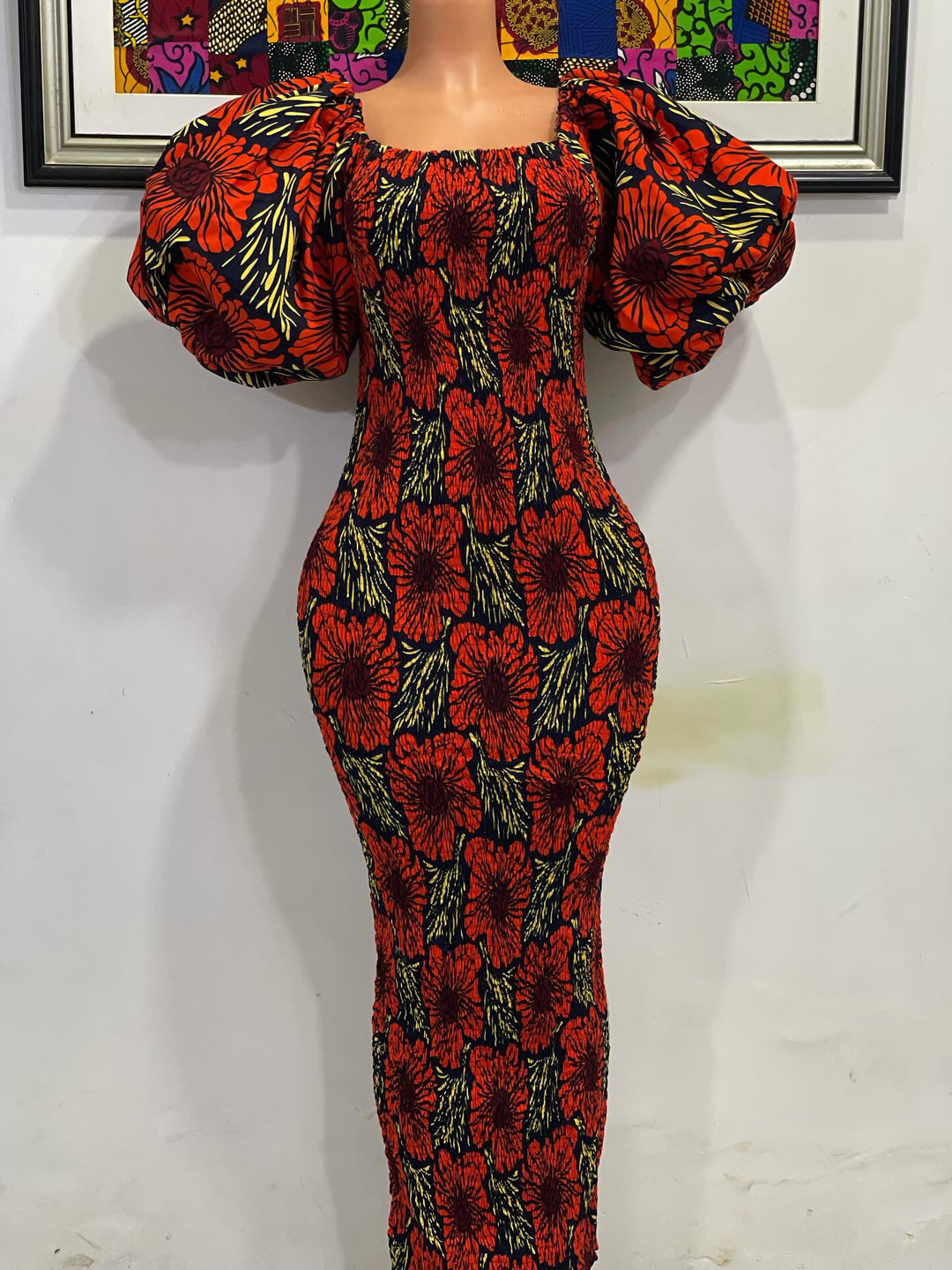 African print stretchy body-con dress with puffy sleeves.