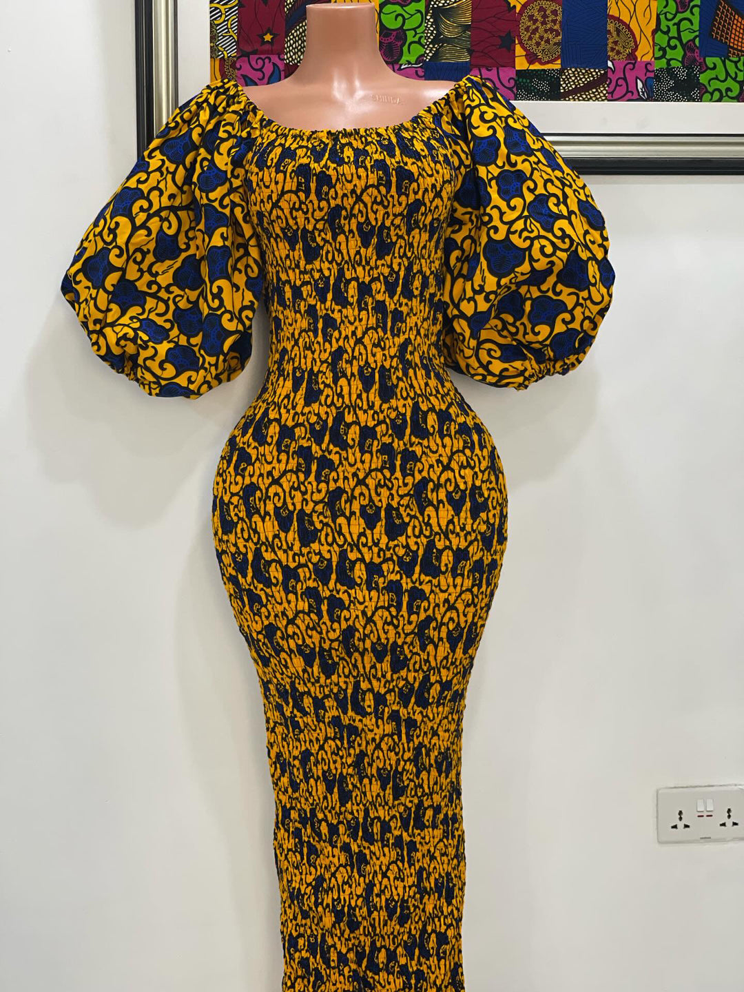 African print stretchy body-con dress with puffy sleeves.