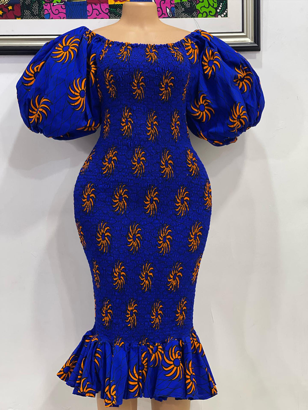 African print smoke body-con dress with puffy sleeves.