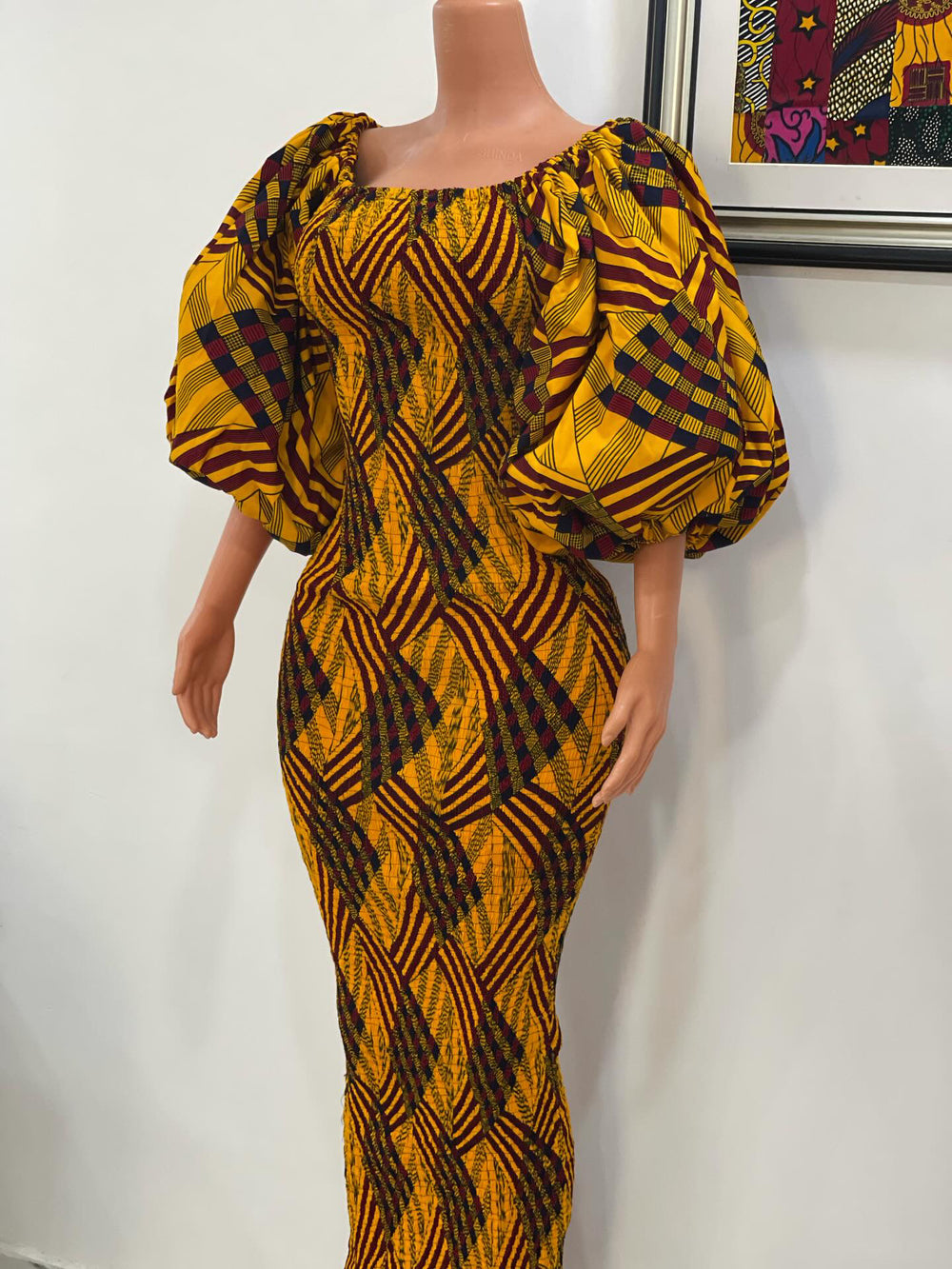 African print stretchy body-con dress with puffy sleeves.