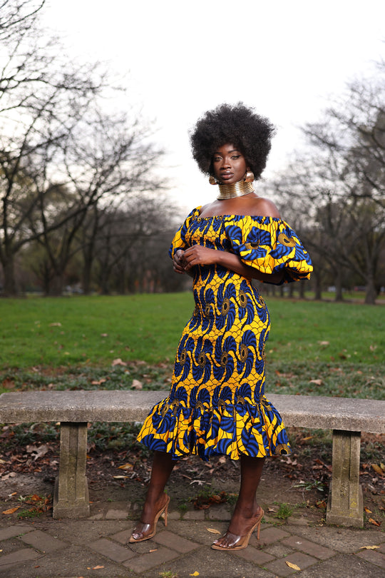 African print smoke body-con dress with puffy sleeves.