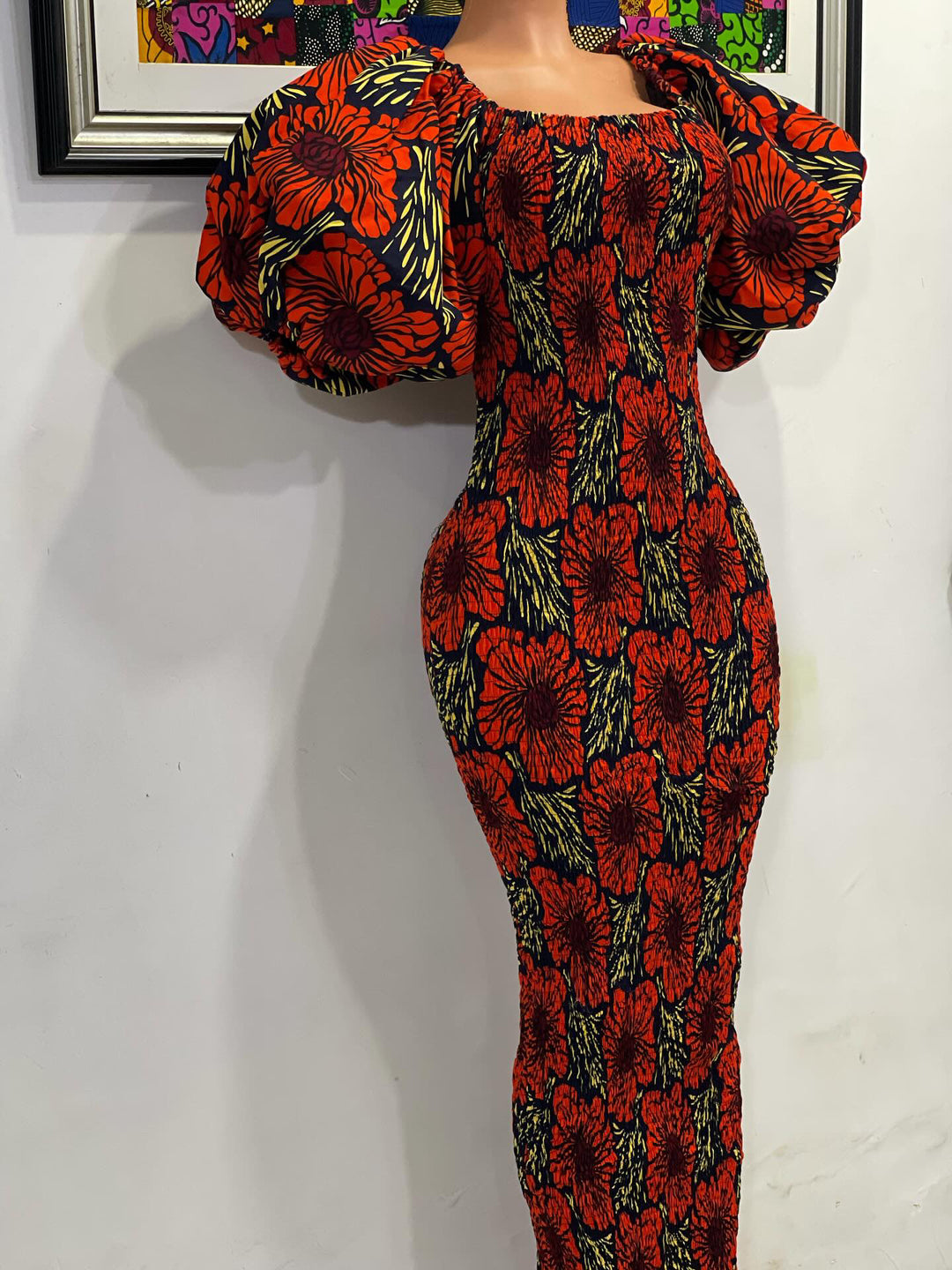 African print stretchy body-con dress with puffy sleeves.