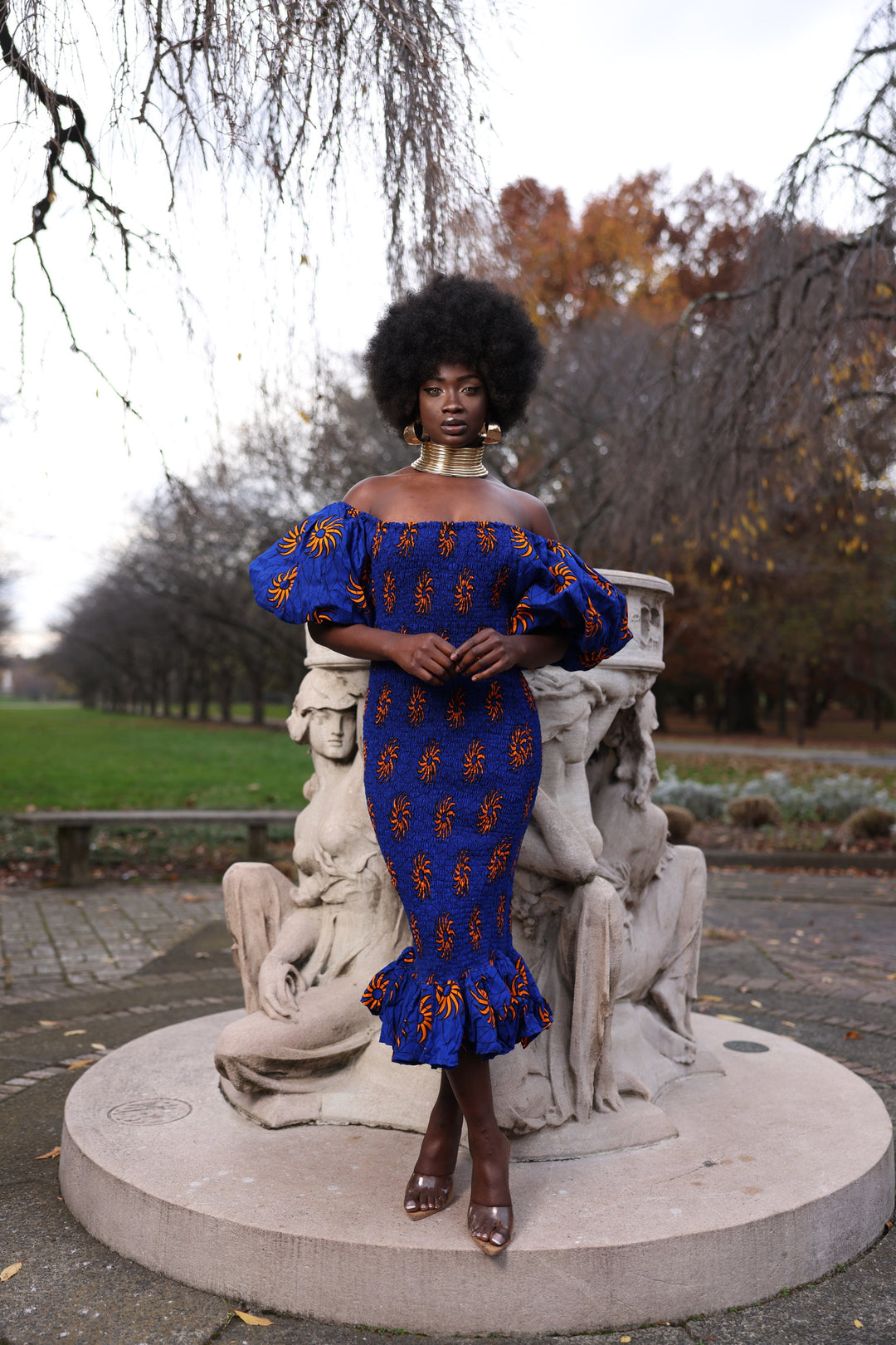 African print smoke body-con dress with puffy sleeves.