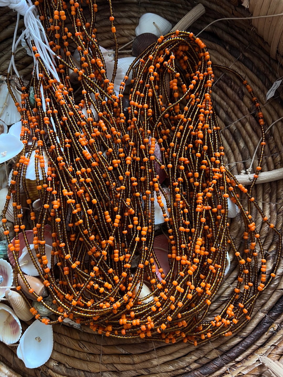 Orange 🍊 and brown🤎 waist beads.